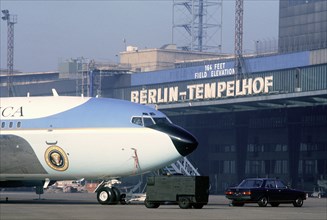 Air Force One, the VC-137C Stratoliner aircraft used to transport the president, sits in a roped-off area near the terminal building at Tempelhof Central Airport.