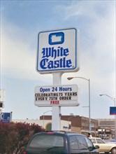 White Castle restaurant sign in Chicago south suburbs, sign celebrates their 75th anniversary circa 1996.