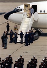 Vice Premier Geng Biao of China and his wife wave goodbye as they prepare to leave California aboard Vice President Walter Mondale's official aircraft..
