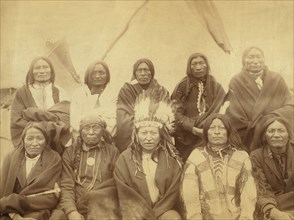 Group portrait of Lakota chiefs, five standing and five sitting with tipi in background--probably on or near Pine Ridge Indian Reservation 1891.