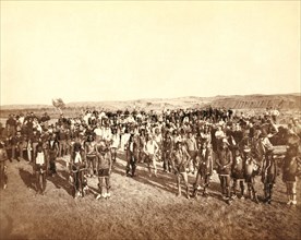 At the Dance. Part of the 8th U.S. Cavalry and 3rd Infantry at the great Indian Grass Dance on Reservation 1890.