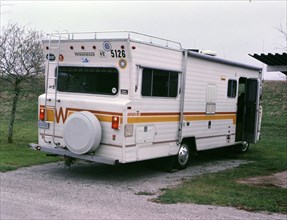 A Winnebago recreational vehicle parked at a campsite circa 1987.