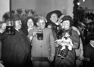 German men drinking beer and celebrating circa 1930s (possibly around Christmas or New Years) .