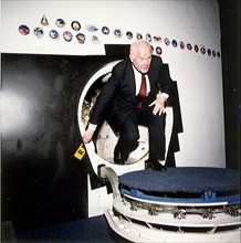 1989 - Senator John Glenn egresses a Shuttle trainer during a tour .