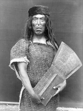 Edward S. Curits Native American Indians - Hakalahl, Nakoaktok chief, holding copper Wanistakila ('takes everything out of the house'-a reference to its value) circa 1914.