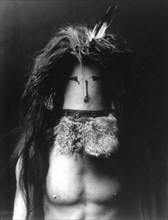 Edward S. Curtis Native American Indians - Barechested Navajo man wearing mask of Haschebaad, a benevolent female deity circa 1905.