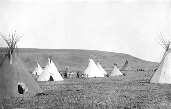 Edward S. Curtis Native American Indians - Atsina camp scene tipis on the plains circa 1908.