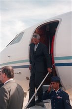 South Africa's President Nelson Mandela steps out the door of the aircraft as he arrives on the flightline..