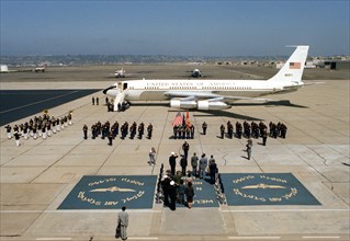 Farewell honors are given to Vice Premier Geng Biao of China and his delegation.  Vice President Walter Mondale's official aircraft is in the background..