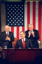 Vice President Dick Cheney and House Speaker Dennis Hastert applaud President George W. Bush Feb. 27, 2001, during a speech to a Joint Session of Congress in the House chamber..