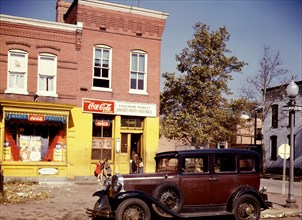 hulman's Market at the southeast corner of N Street and Union Street S.W., Washington, D.C., with a 1931 Chevrolet car parked in front  ca 1941-1942 .