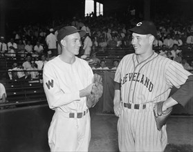 Pitchers Bucky Jacobs, left, Washington's rookie and Bob Feller, from Cleveland, meet before pitching against each other for the first time circa August 2, 1937.