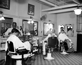 Senators having their hair cut in the Senate Office Building Barber Shop circa 1937.