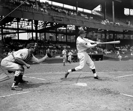 Buck Jacobs, Washington baseball player swinging at a baseball while at bat circa 1937.