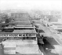California History - Sacramento City, K Street, looking West from the Masonic Hall - [W]averly House Meals 25 cents, several buildings circa 1866.
