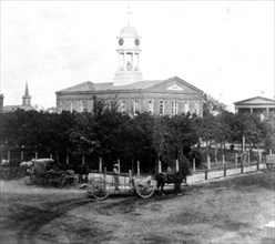 California History - The Court House, Stockton, San Joaquin County - horse drawn wagons in front circa 1866.