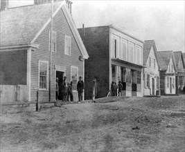 California History - Street View in Mendocino City - Post Office in the foreground with men standing outside circa 1866.