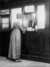 Woman at teller window at Park View Post Office circa 1918.