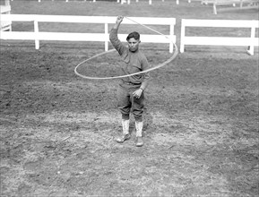 Wild west show performance given by soldiers (trick roping performance) circa 1919.