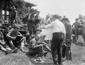 Beekeeping demonstration and instruction for wounded soldiers circa 1919 .