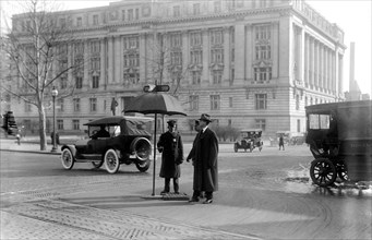 Washington D.C. History - Car on Washington Street obeying stop and go traffic sign circa 1913.
