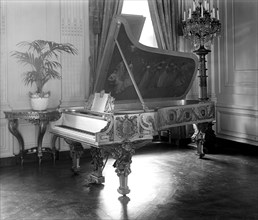 Gold piano inside White House circa 1928.