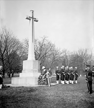 Canada's Governor General, Lord Tweedsmuir, placing a wreath on the Canadian cross in Arlington National Cemetery today circa 1937.