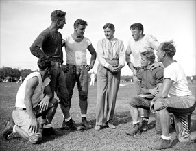 George Marshall, owner of the Washington Redskins, talks with some of his players, left to right: Wayne Millner, Charlie Malone, Vic Carroll, George Marshall, Bill Young, Ed Michaels, Jim Garber circa...
