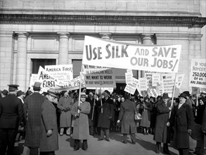 January 28, 1938 - Members of the American Federation of Hosiery Workers arriving today at Union Station today from they staged a parade to the White House as a protest against the boycott of Japanese...