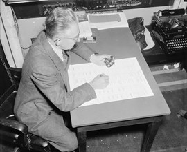 Hans Jurgensen, tally clerk of the house recording the results of a tally vote on a bill in congress circa 1937 or 1938.