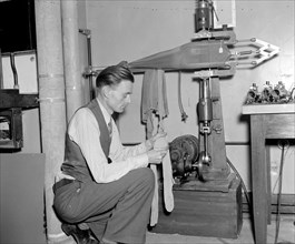 Government waste - Government employee testing panty hose circa 1938.