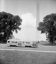 Streamlined street car in front of the Washington Monument circa 1938.