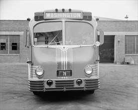 Parked Greyhound Bus bound for Washington circa 1938 .
