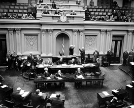 Scene in the United States Senate chamber as Vice President Garner administers the oath to Senator Elmer Thomas, re-elected from Oklahoma in last November's election circa 1/4/1939.