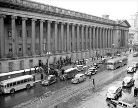 Cars, buses and pedestrians in Washington D.C. street scene circa 1938 or 1939 (15th Street) .