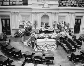 The body of the late Senator from Illinois, J. Ham Lewis lying in state in the Senate chamber circa 1939.