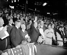 Vice President Garner throwing out first ball at baseball game circa 1939.