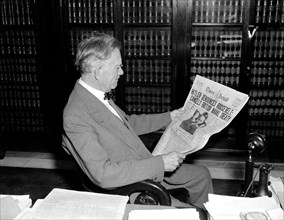 April 28, 1939 - Senator William Borah reads newspaper headlines on Adolf Hitler .