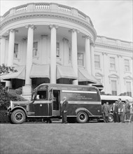 James A. Farley and new philatelic truck at White House. The Post Office's new philatelic stamp truck will begin a tour of the United States today following ceremonies at the White House circa 1939.