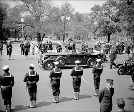King and Queen of England (Great Britain) in an automobile visiting Washington D.C. circa 1938 or 1939 .
