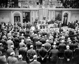 Scene in the House chamber today as Reverend James Shera Montgomery, chaplain of the House, delivered the prayer to open the special session called by President Roosevelt, 11/15/37.