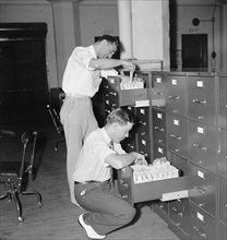 Social Security History -  workers in the Baltimore Records Office at work on the 'holding files' for the Social Security Administration circa 1937 or 1938 .