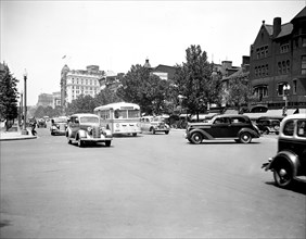 Bus and cars in Washington D.C. traffic street scene circa July 1936.