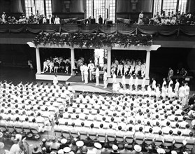 Annapolis graduation exercises - presenting diplomas to graduates  circa 1936.