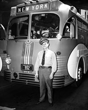 Greyhound Bus and bus driver standing in front of his New York bound bus circa 1937 .