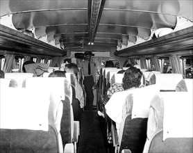 Bus passengers inside a Greyhound bus circa 1937.
