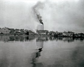 Image of the Rathbun Company's industrial sites at the east end of the waterfront in Deseronto, Ontario, looking north from the Bay of Quinte circa 1907.