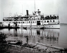 The Brockville, with many people on board. This photograph was taken on 9 July 1908, possibly at Massassauga Point, Prince Edward County, Ontario.