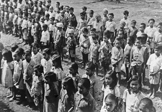 Ambarawa: The Dutch Indian school was festively opened on 20 September. The children listen to the teacher circa September 20, 1947 / Location Indonesia, Dutch East Indies.