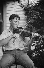 Wayne Perry playing fiddle, Crowley, Louisiana circa 1934-1950.